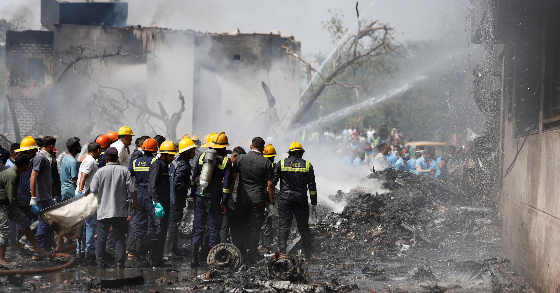 At least 30 killed as Air India plane with 242 on board crashes near Ahmedabad